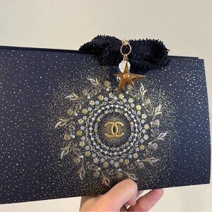 CHANEL Black and Gold Star Charm box come with 2 charms